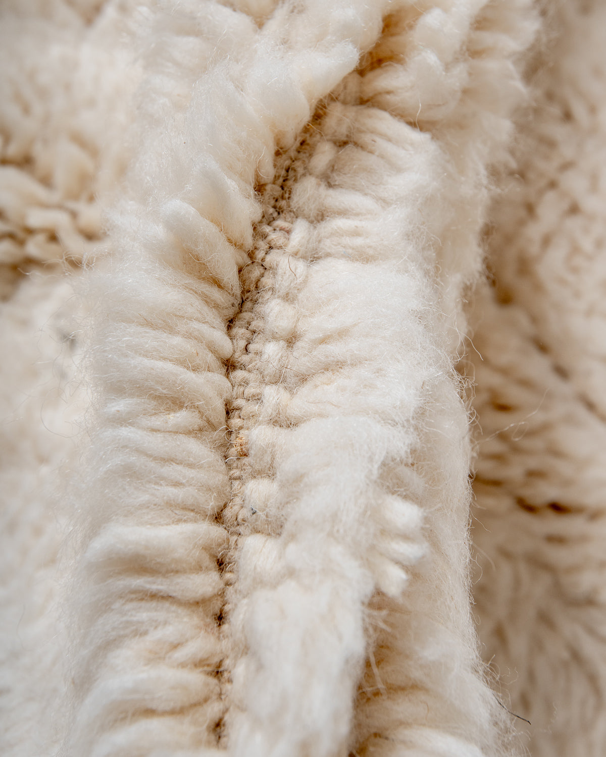 Modern, designer, handcrafted Berber rug from Morocco. Beniourain carpet with minimalist design, natural wool pile and a fluffy texture.