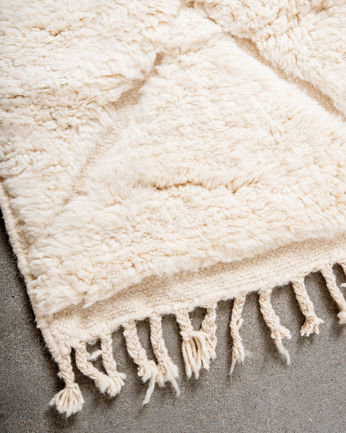 Modern, designer, handcrafted Berber rug from Morocco. Beniourain carpet with minimalist design, natural wool pile and a fluffy texture.