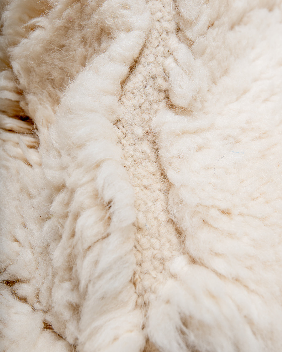 Modern, designer, handcrafted Berber rug from Morocco. Beniourain carpet with minimalist design, natural wool pile and a fluffy texture.