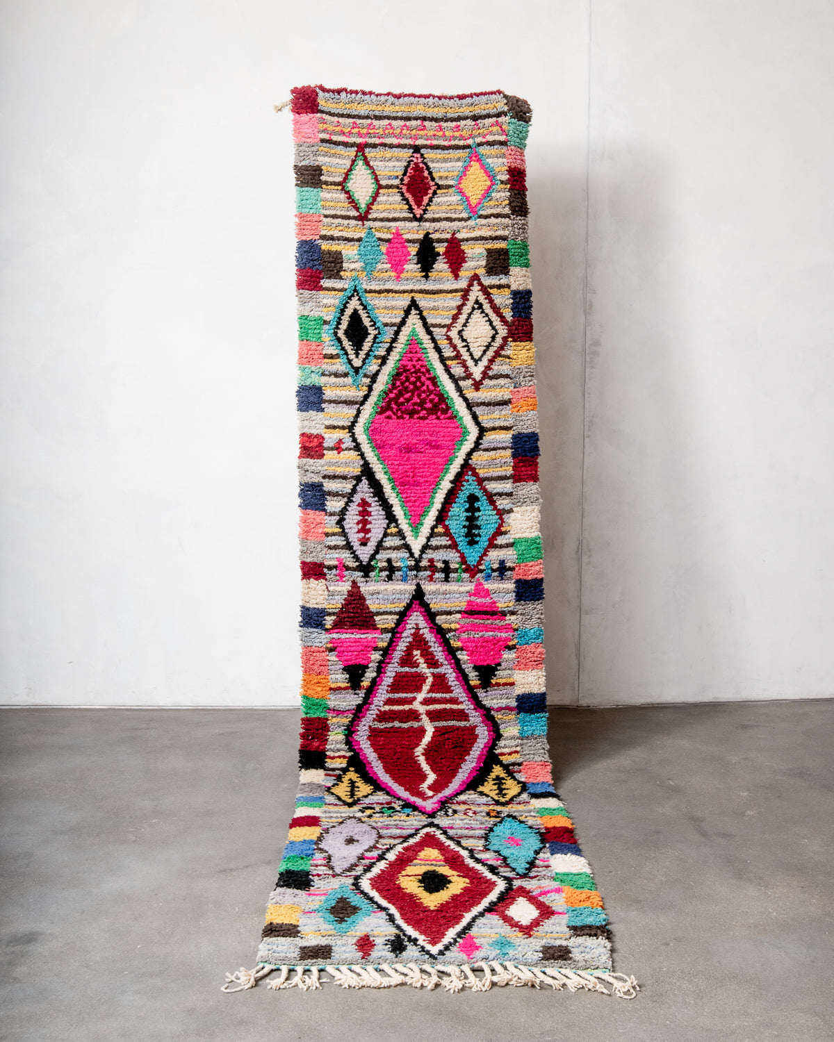 Modern, designer, handcrafted Berber runner rug from Morocco. Beniourain carpet with beautiful colours and patterns and fluffy wool texture.