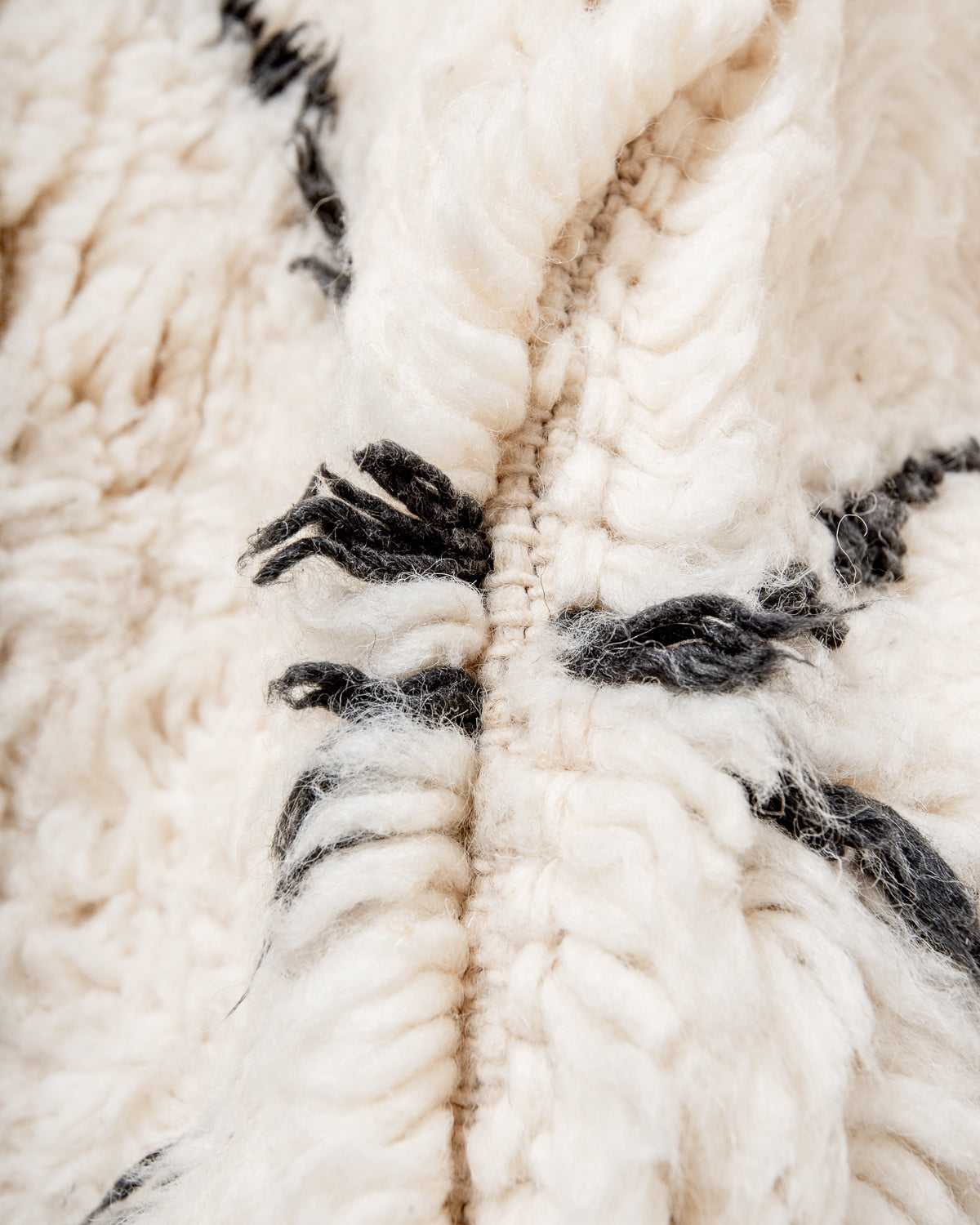 Modern, designer, handcrafted Berber rug from Morocco. Beniourain carpet with minimalist design, natural wool pile and a fluffy texture.