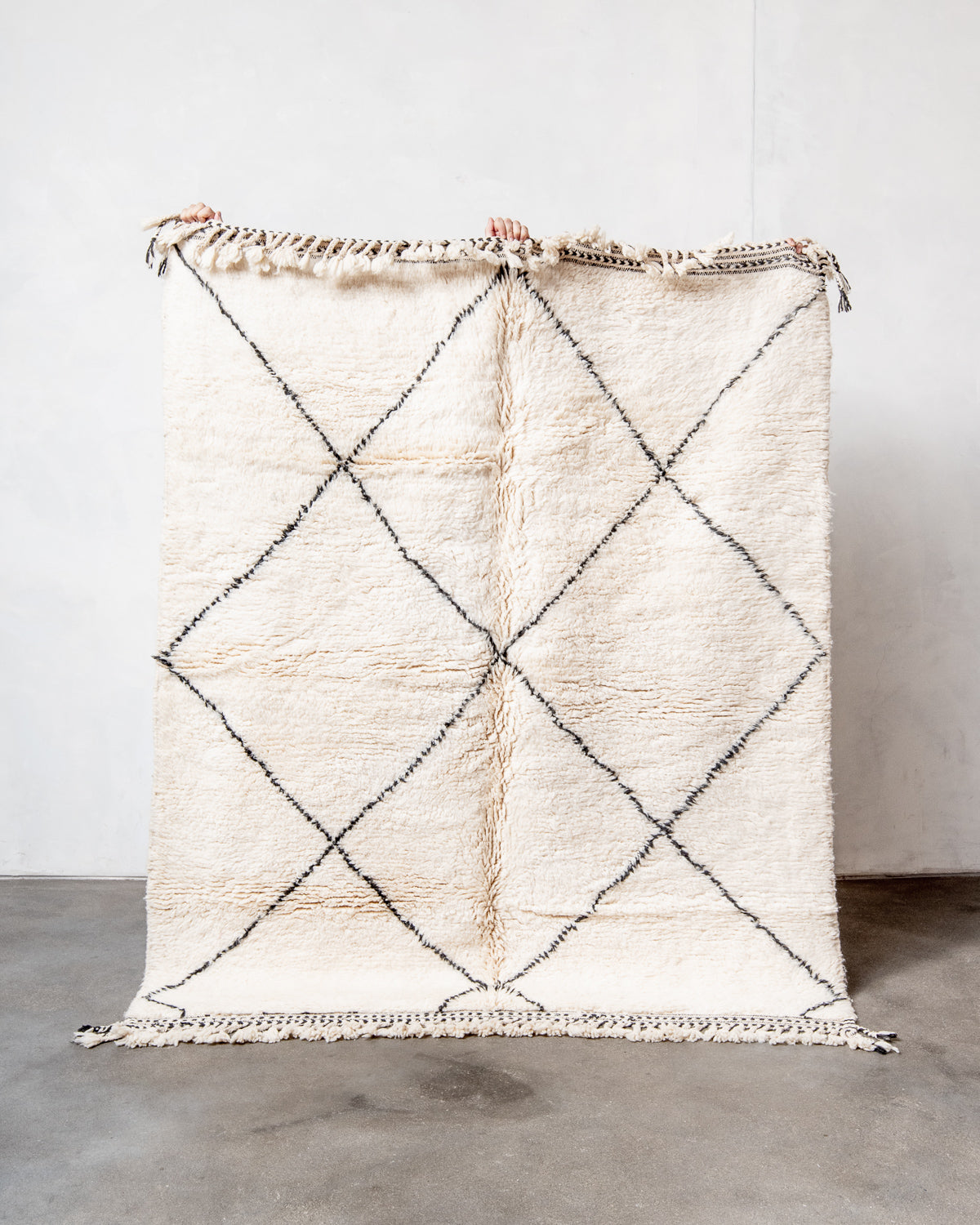 Modern, designer, handcrafted Berber rug from Morocco. Beniourain carpet with minimalist design, natural wool pile and a fluffy texture.