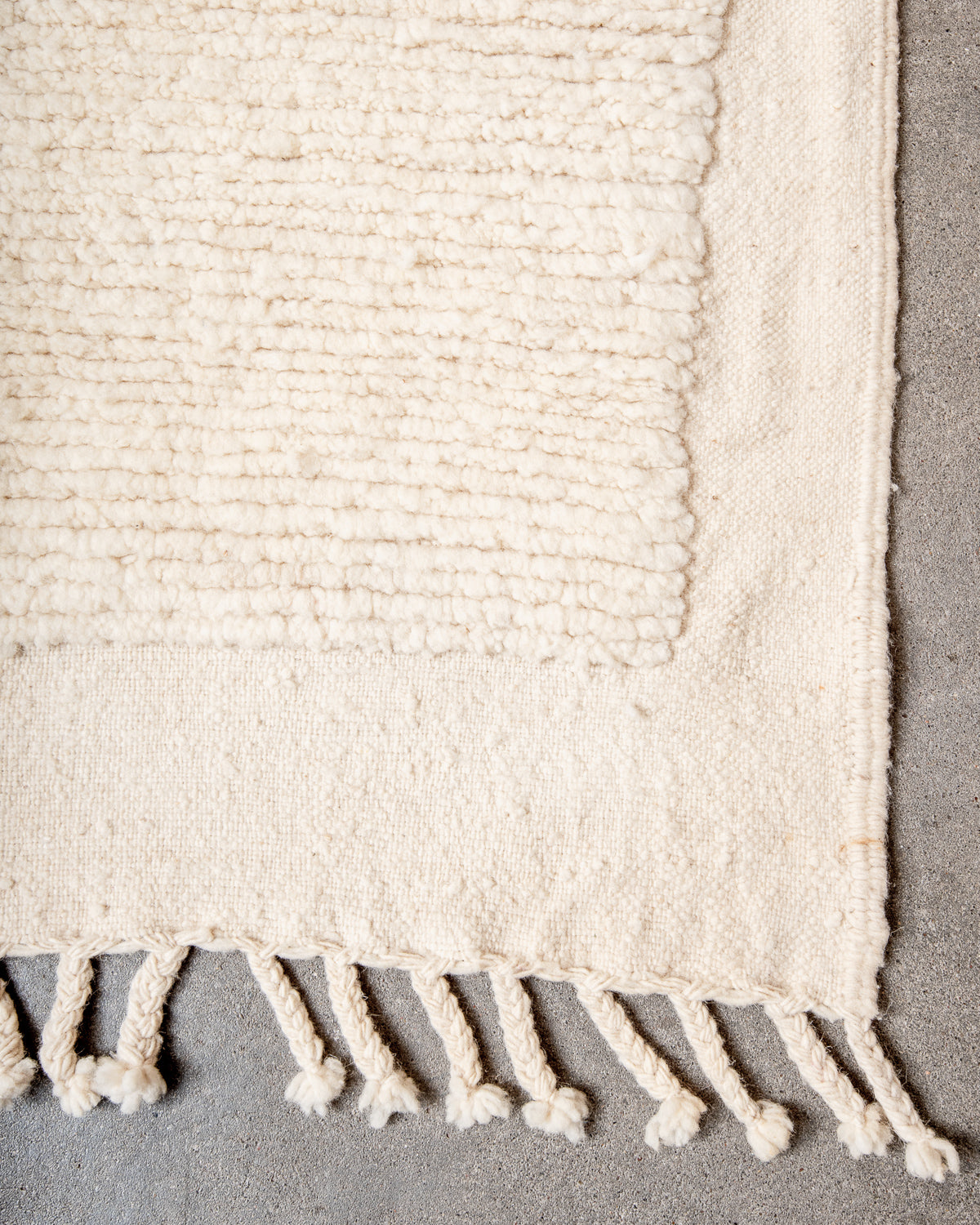 Modern, designer, handcrafted Berber rug from Morocco. Beniourain carpet with minimalist design, natural wool pile and a fluffy texture.