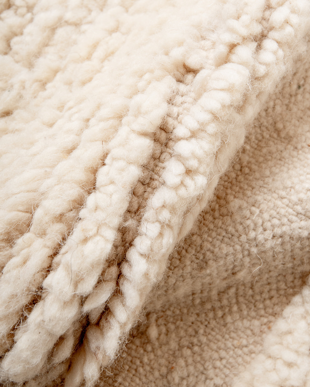 Modern, designer, handcrafted Berber rug from Morocco. Beniourain carpet with minimalist design, natural wool pile and a fluffy texture.