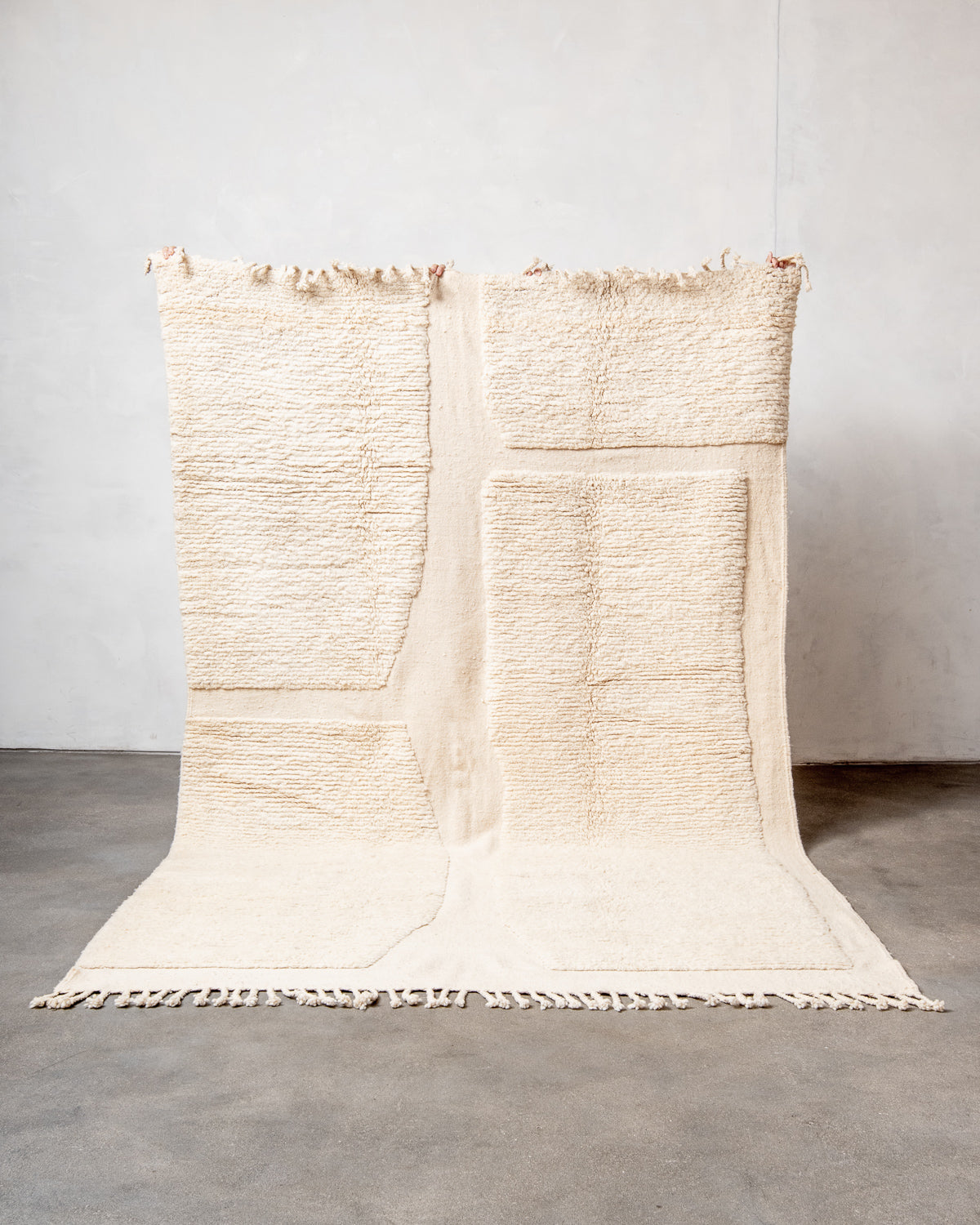 Modern, designer, handcrafted Berber rug from Morocco. Beniourain carpet with minimalist design, natural wool pile and a fluffy texture.