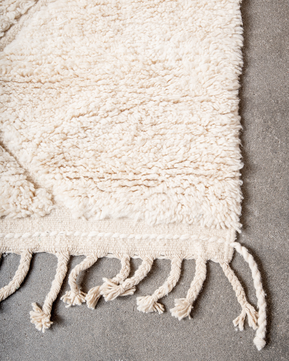 Modern, designer, handcrafted Berber rug from Morocco. Beniourain carpet with minimalist design, natural wool pile and a fluffy texture.