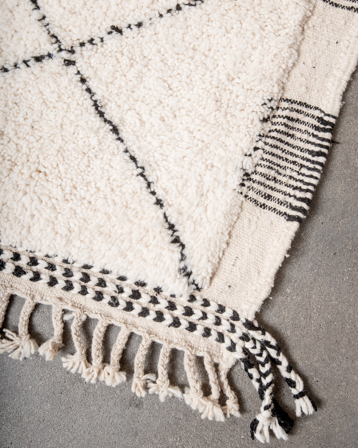 Modern, designer, handcrafted Berber rug from Morocco. Beniourain carpet with minimalist design, natural wool pile and a fluffy texture.