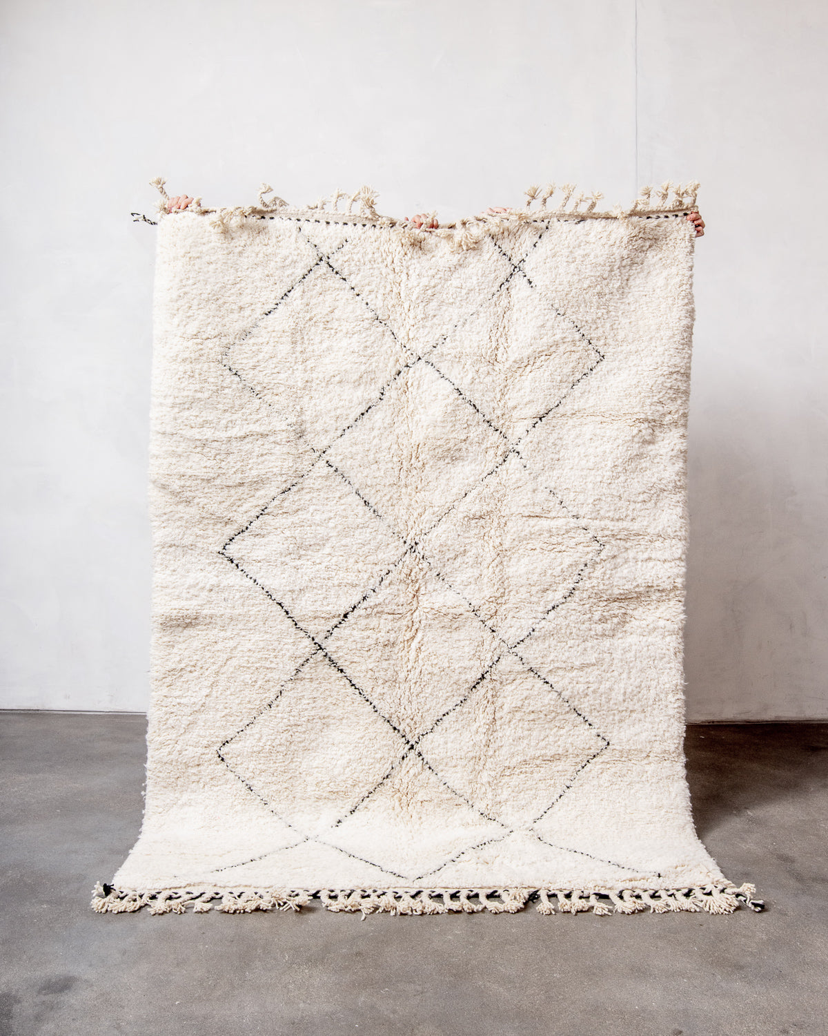 Modern, designer, handcrafted Berber rug from Morocco. Beniourain carpet with minimalist design, natural wool pile and a fluffy texture.