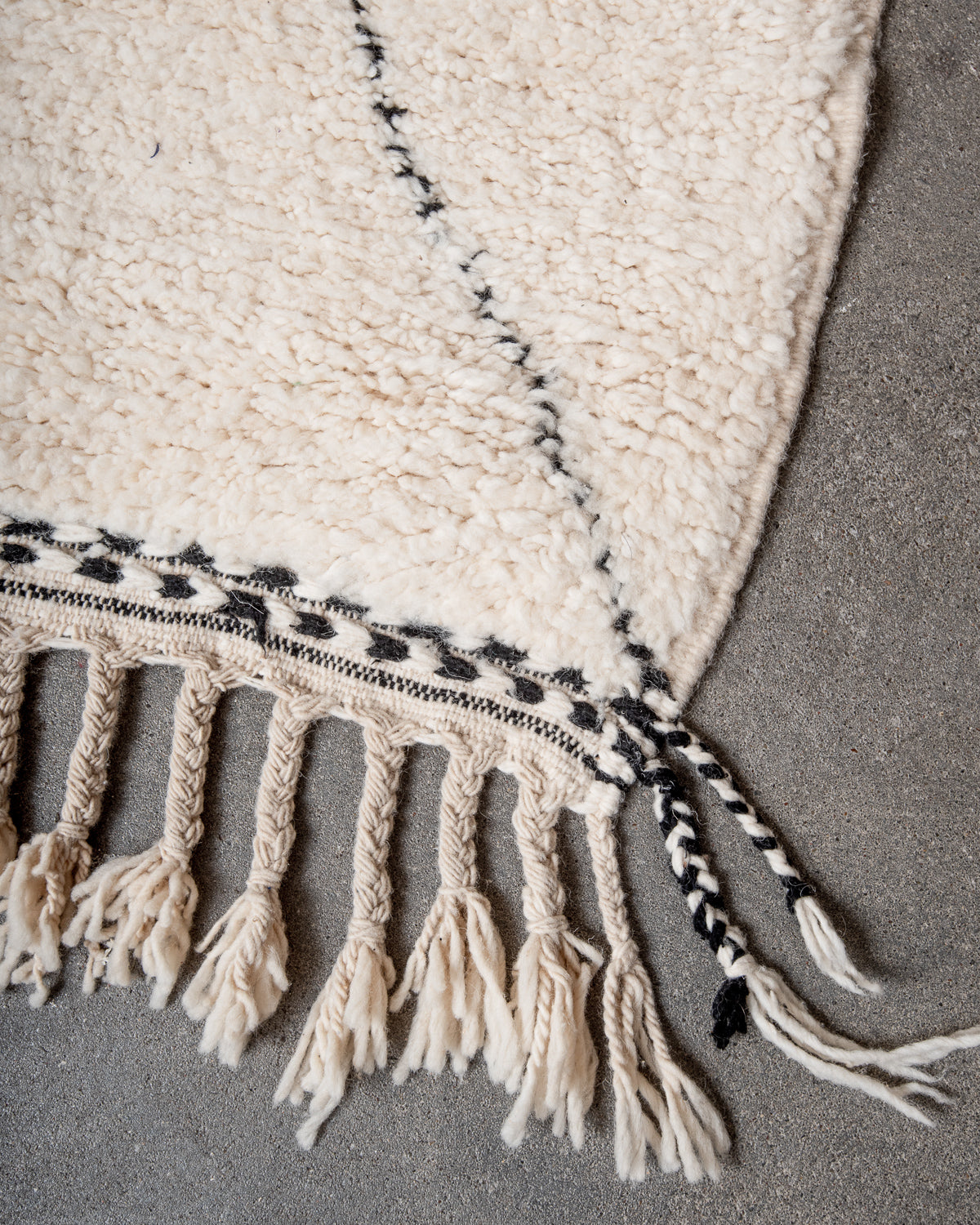 Modern, designer, handcrafted Berber rug from Morocco. Beniourain carpet with minimalist design, natural wool pile and a fluffy texture.
