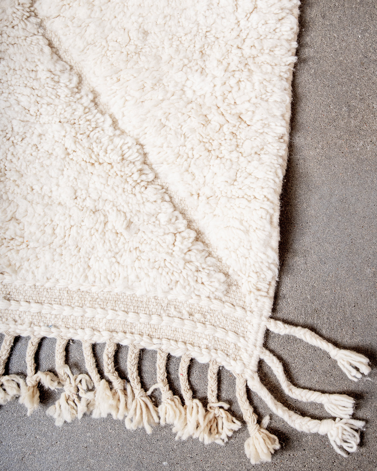 Modern, designer, handcrafted Berber rug from Morocco. Beniourain carpet with minimalist design, natural wool pile and a fluffy texture.