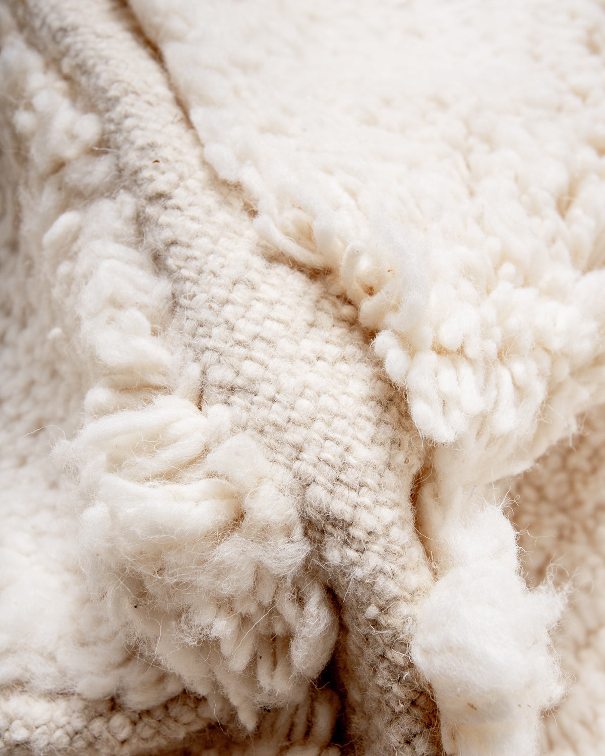 Modern, designer, handcrafted Berber rug from Morocco. Beniourain carpet with minimalist design, natural wool pile and a fluffy texture.