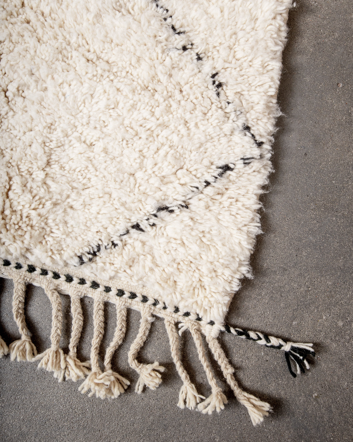 Modern, designer, handcrafted Berber rug from Morocco. Beniourain carpet with minimalist design, natural wool pile and a fluffy texture.