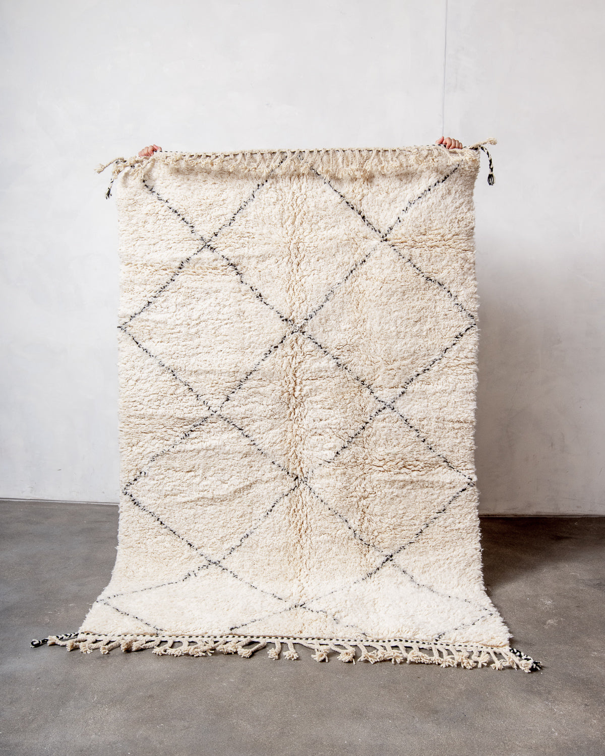 Modern, designer, handcrafted Berber rug from Morocco. Beniourain carpet with minimalist design, natural wool pile and a fluffy texture.