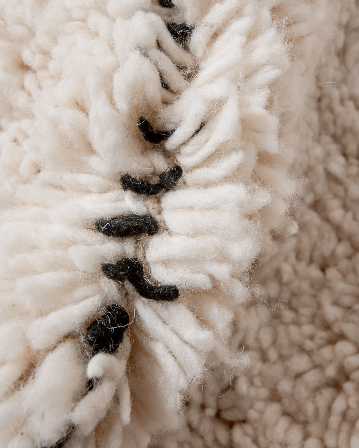 Modern, designer, handcrafted Berber rug from Morocco. Beniourain carpet with minimalist design, natural wool pile and a fluffy texture.