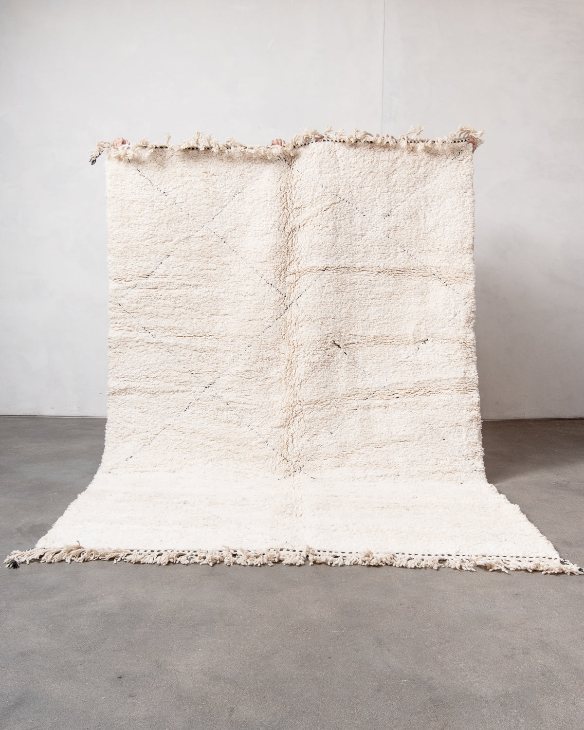 Modern, designer, handcrafted Berber rug from Morocco. Beniourain carpet with minimalist design, natural wool pile and a fluffy texture.