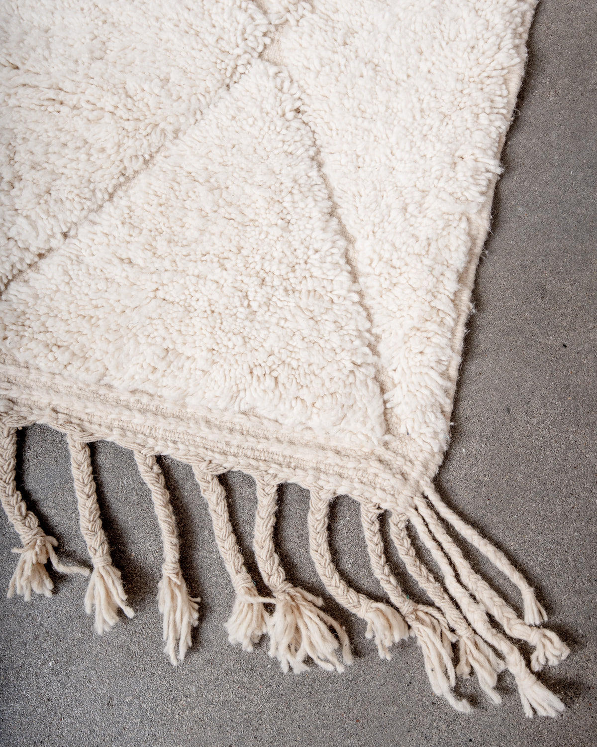 Modern, designer, handcrafted Berber rug from Morocco. Beniourain carpet with minimalist design, natural wool pile and a fluffy texture.