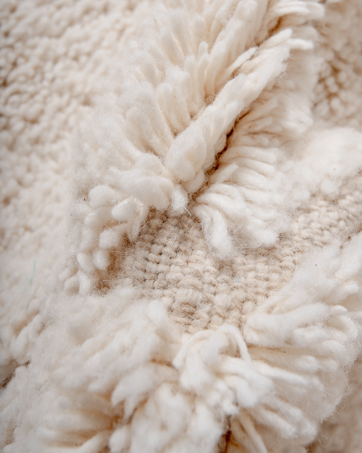 Modern, designer, handcrafted Berber rug from Morocco. Beniourain carpet with minimalist design, natural wool pile and a fluffy texture.