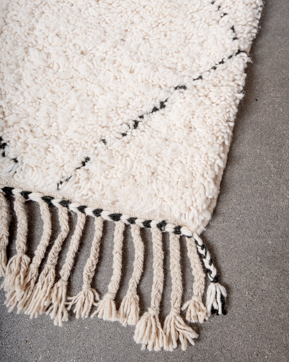 Modern, designer, handcrafted Berber rug from Morocco. Beniourain carpet with minimalist design, natural wool pile and a fluffy texture.