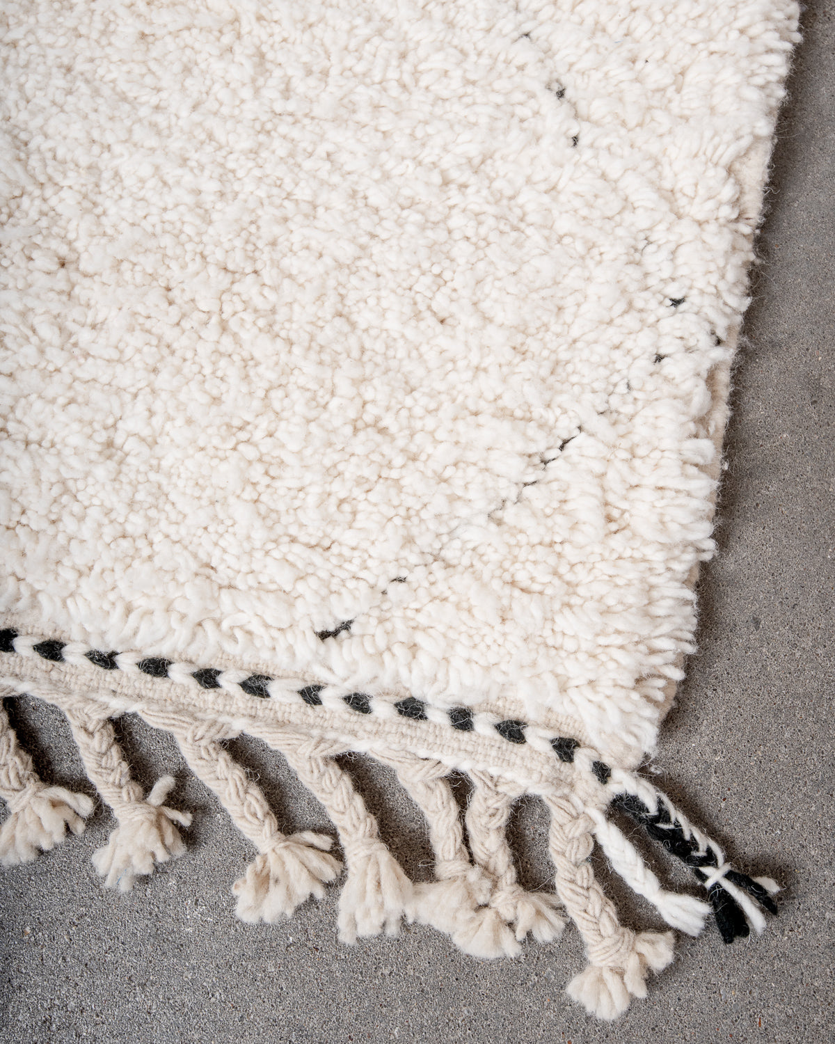 Modern, designer, handcrafted Berber rug from Morocco. Beniourain carpet with minimalist design, natural wool pile and a fluffy texture.