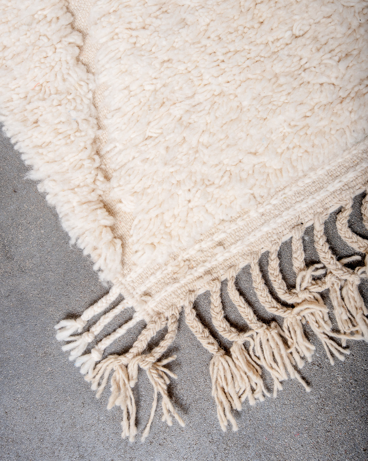 Modern, designer, handcrafted Berber rug from Morocco. Beniourain carpet with minimalist design, natural wool pile and a fluffy texture.