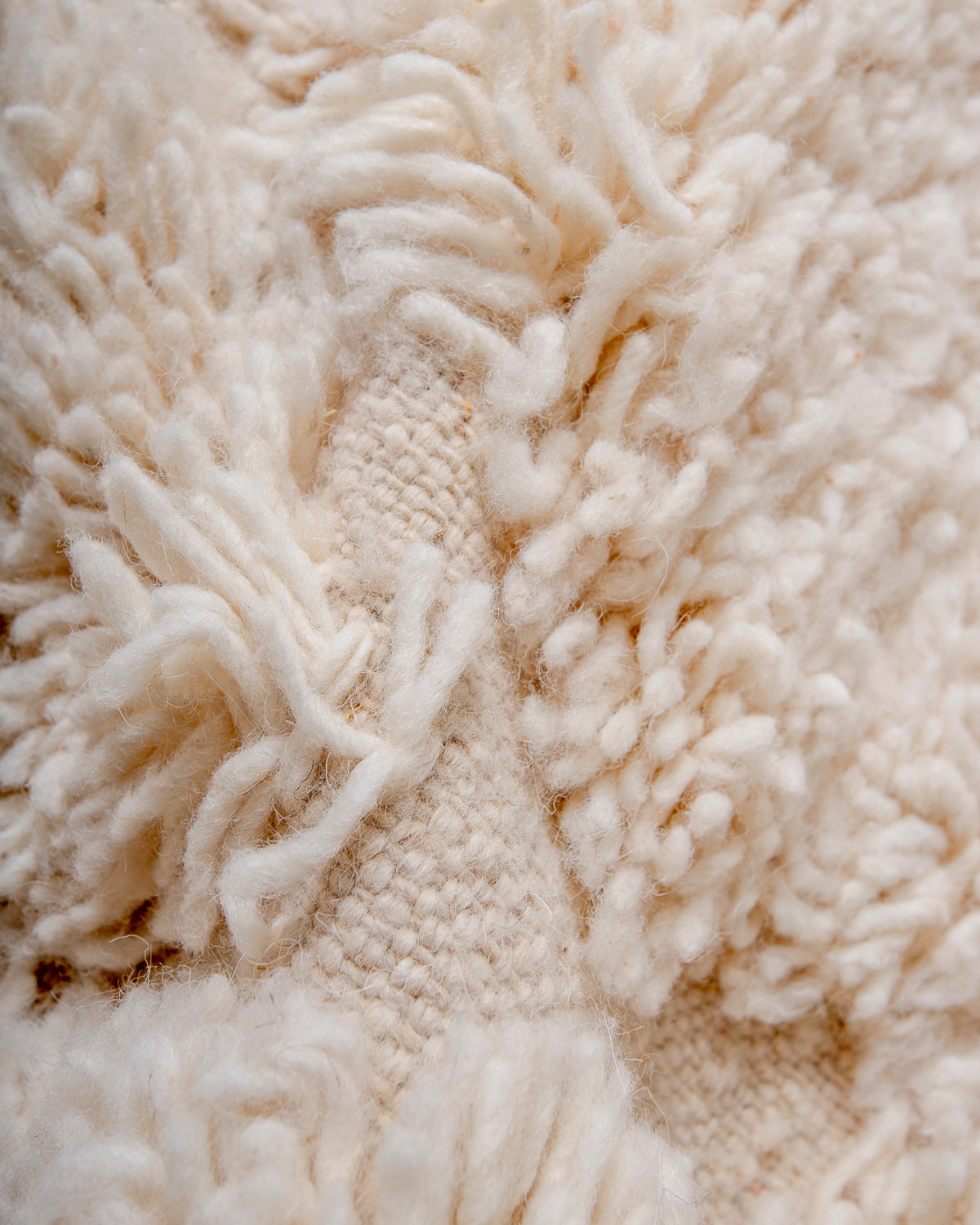 Modern, designer, handcrafted Berber rug from Morocco. Beniourain carpet with minimalist design, natural wool pile and a fluffy texture.