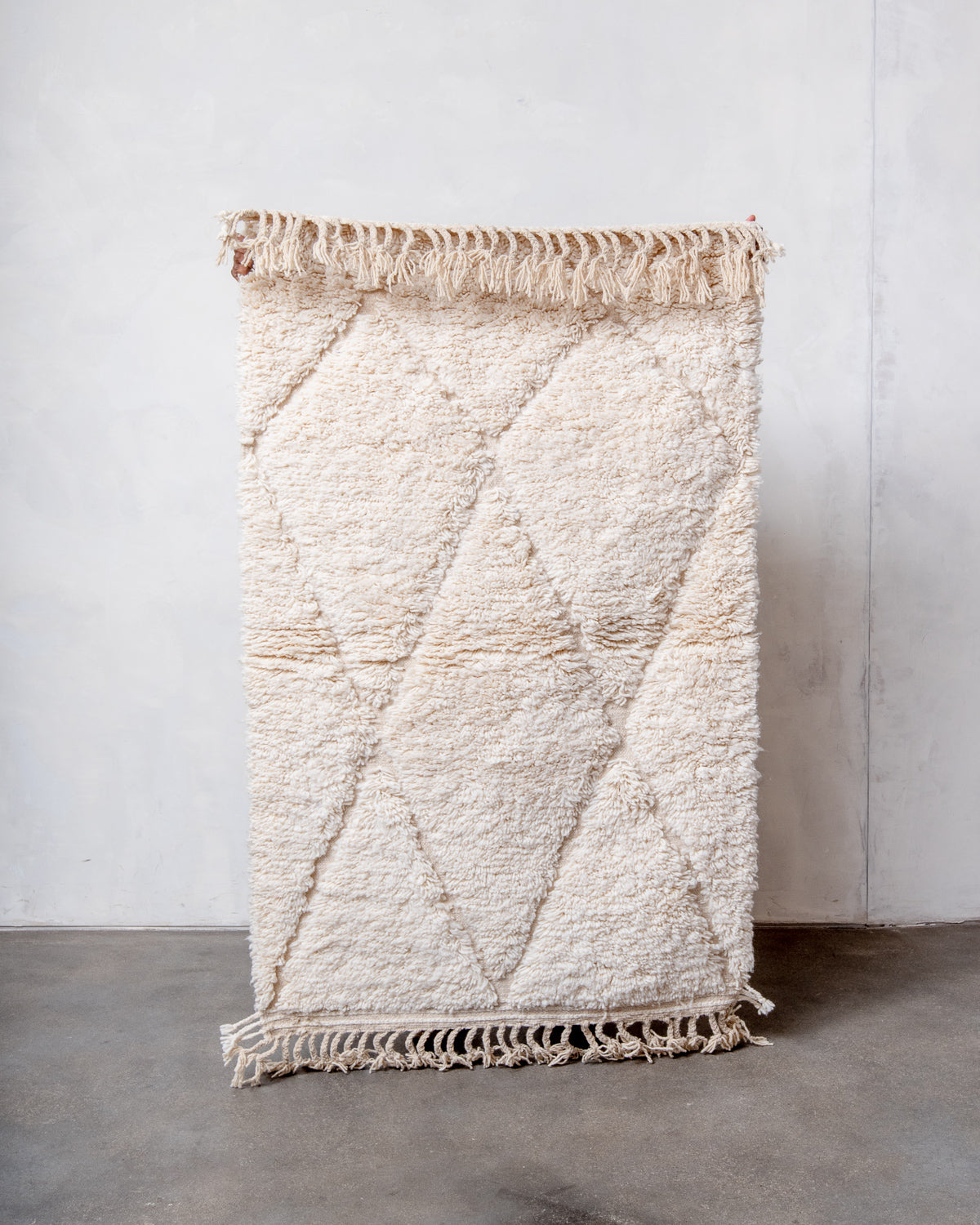 Modern, designer, handcrafted Berber rug from Morocco. Beniourain carpet with minimalist design, natural wool pile and a fluffy texture.
