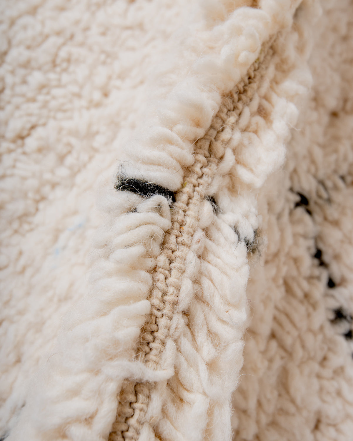 Modern, designer, handcrafted Berber rug from Morocco. Beniourain carpet with minimalist design, natural wool pile and a fluffy texture.