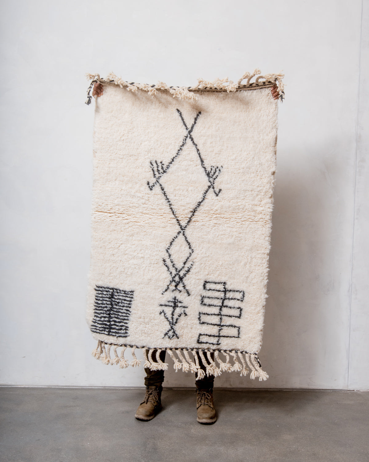 Modern, designer, handcrafted Berber rug from Morocco. Beniourain carpet with minimalist design, natural wool pile and a fluffy texture.