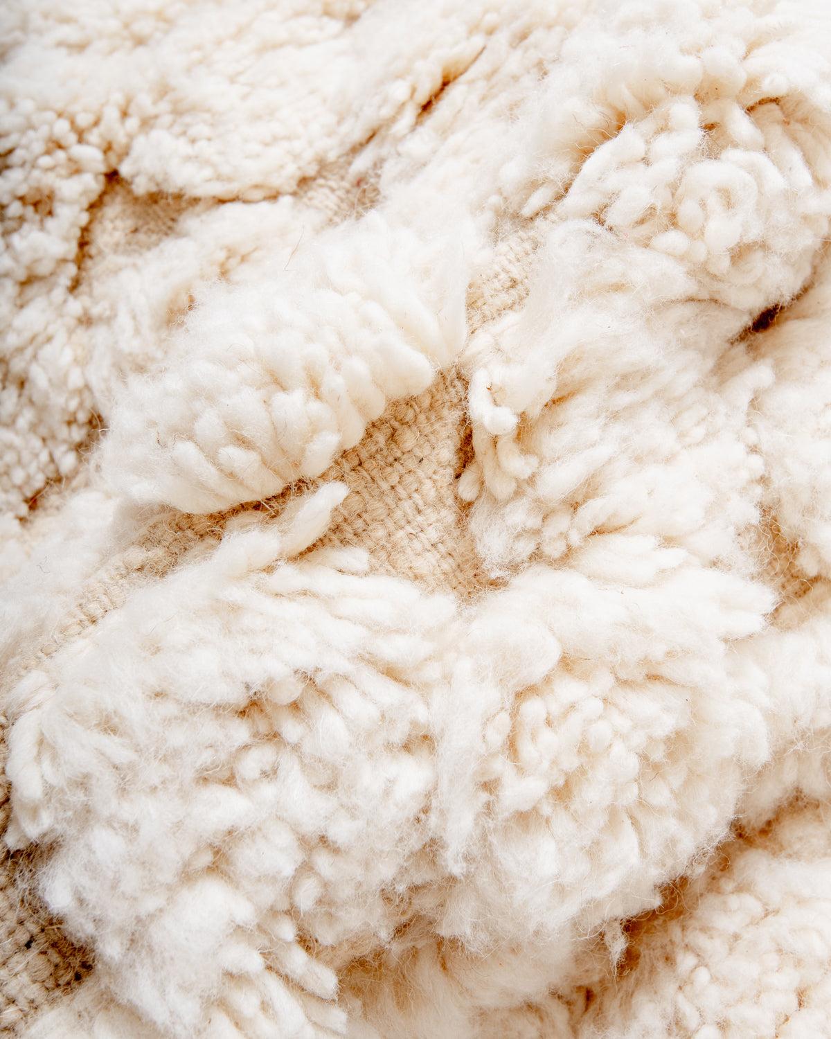 Modern, designer, handcrafted Berber rug from Morocco. Beniourain carpet with minimalist design, natural wool pile and a fluffy texture.