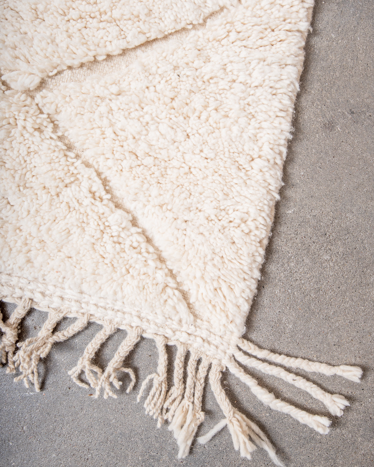 Modern, designer, handcrafted Berber rug from Morocco. Beniourain carpet with minimalist design, natural wool pile and a fluffy texture.