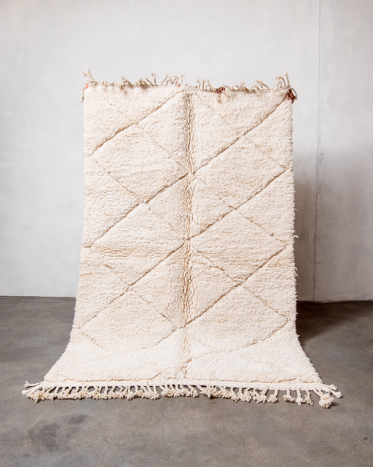 Modern, designer, handcrafted Berber rug from Morocco. Beniourain carpet with minimalist design, natural wool pile and a fluffy texture.