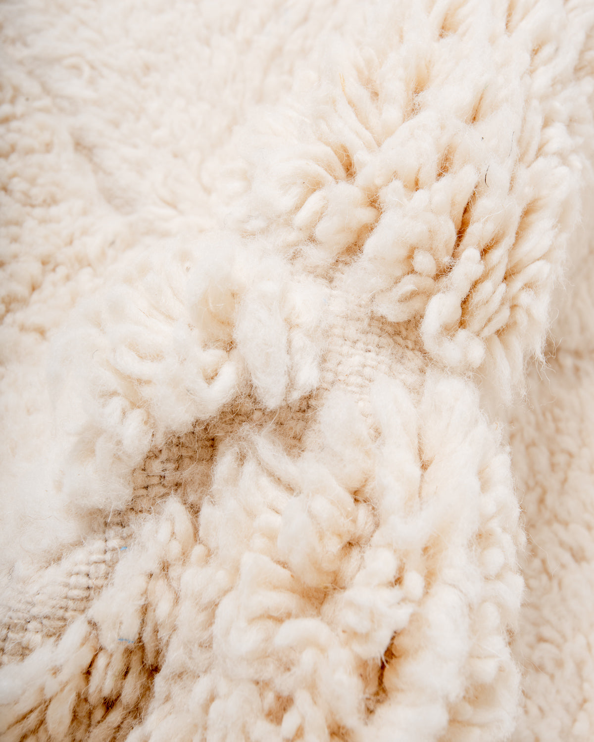 Modern, designer, handcrafted Berber rug from Morocco. Beniourain carpet with minimalist design, natural wool pile and a fluffy texture.