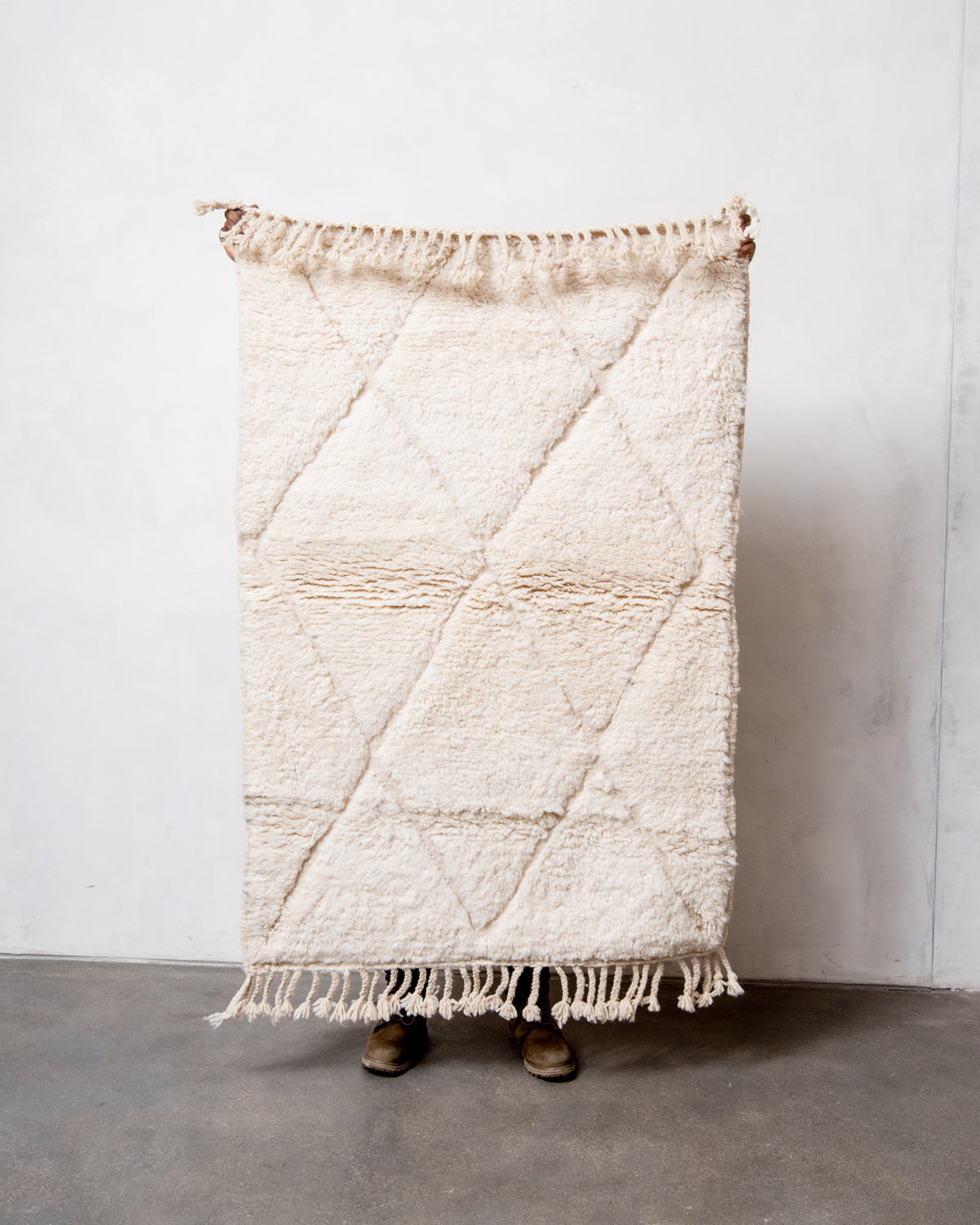 Modern, designer, handcrafted Berber rug from Morocco. Beniourain carpet with minimalist design, natural wool pile and a fluffy texture.