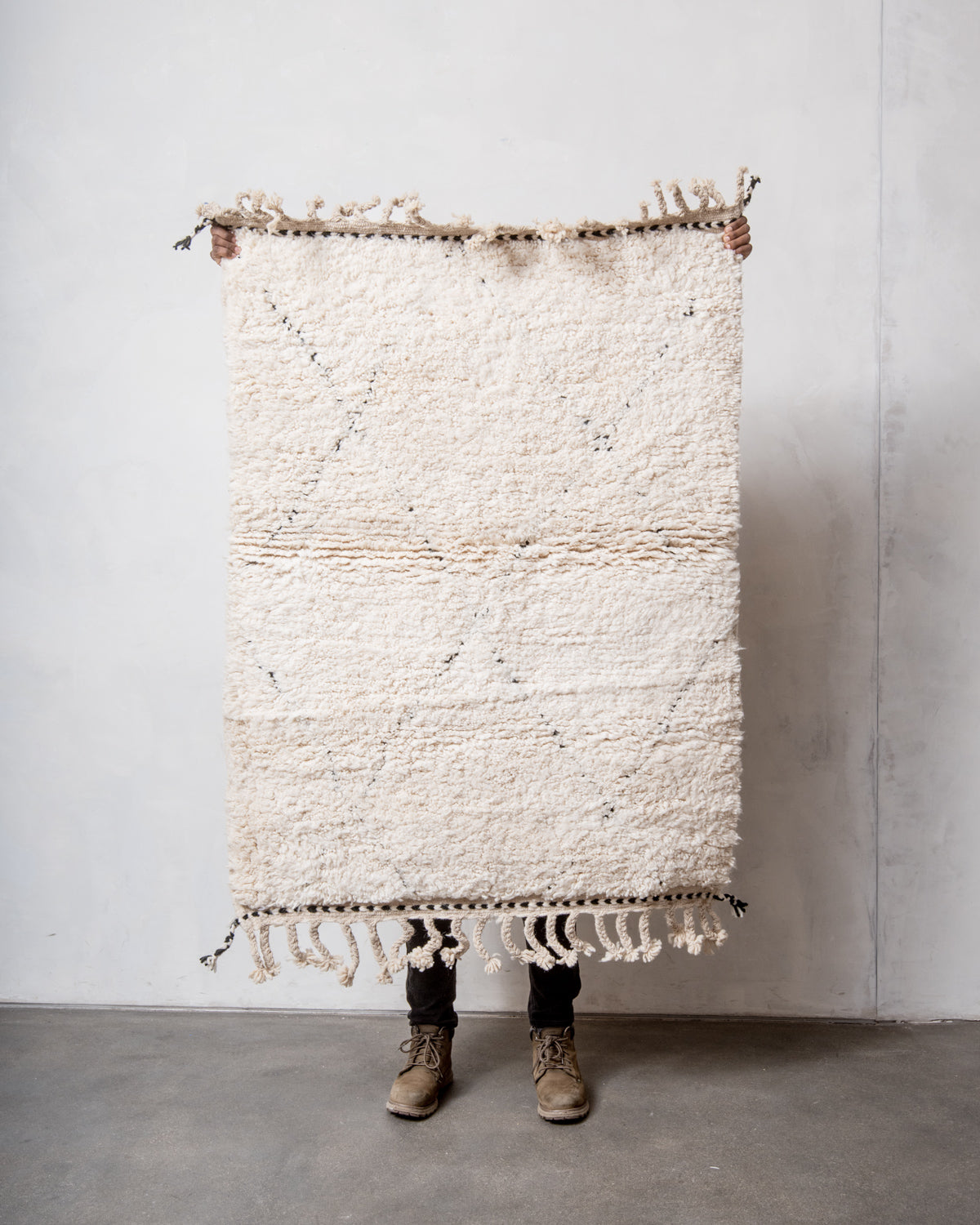 Modern, designer, handcrafted Berber rug from Morocco. Beniourain carpet with minimalist design, natural wool pile and a fluffy texture.