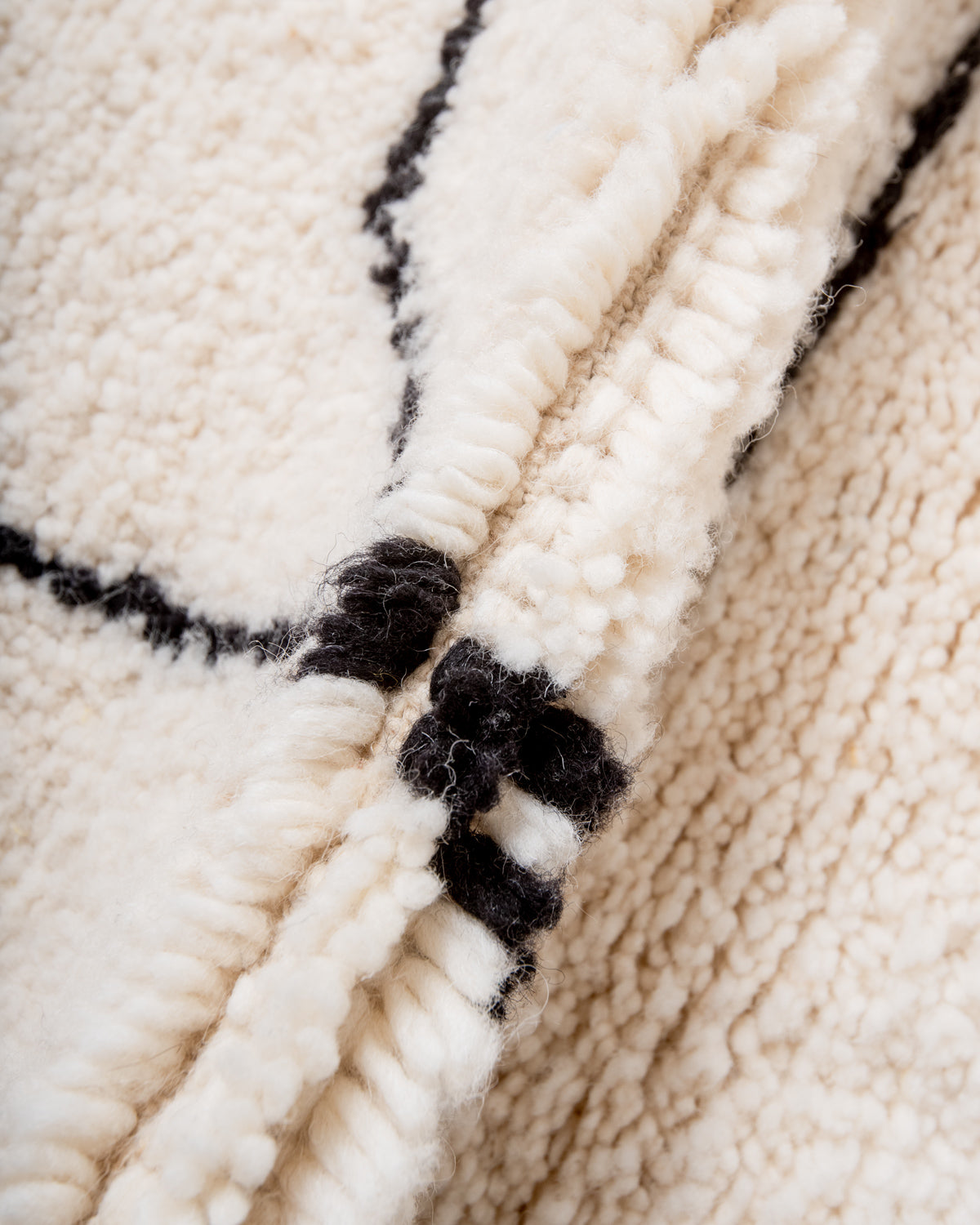 Modern, designer, handcrafted Berber rug from Morocco. Beniourain carpet with minimalist design, natural wool pile and a fluffy texture.