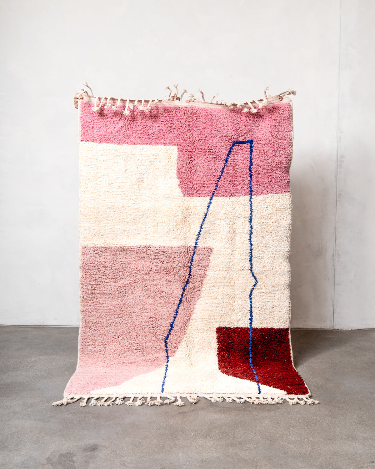 Modern, designer, handcrafted Berber rug from Morocco. Beniourain carpet with beautiful colours and patterns and fluffy wool texture.