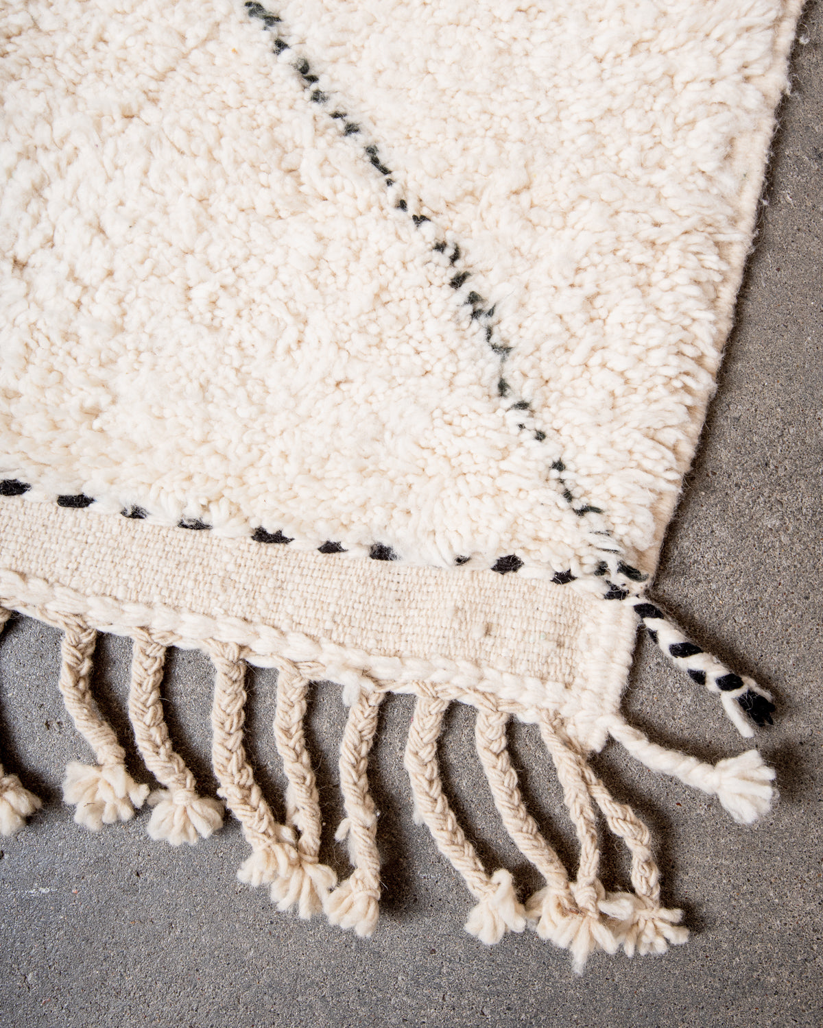 Modern, designer, handcrafted Berber rug from Morocco. Beniourain carpet with minimalist design, natural wool pile and a fluffy texture.