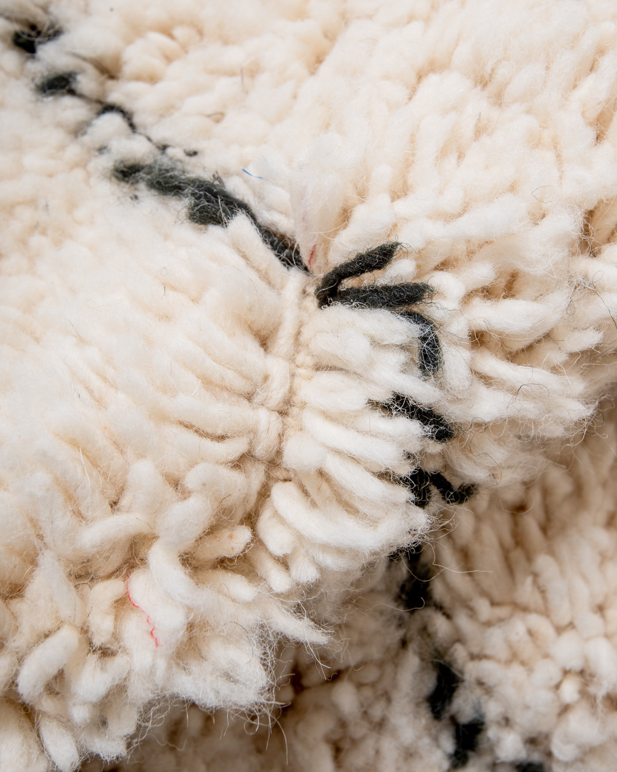 Modern, designer, handcrafted Berber rug from Morocco. Beniourain carpet with minimalist design, natural wool pile and a fluffy texture.