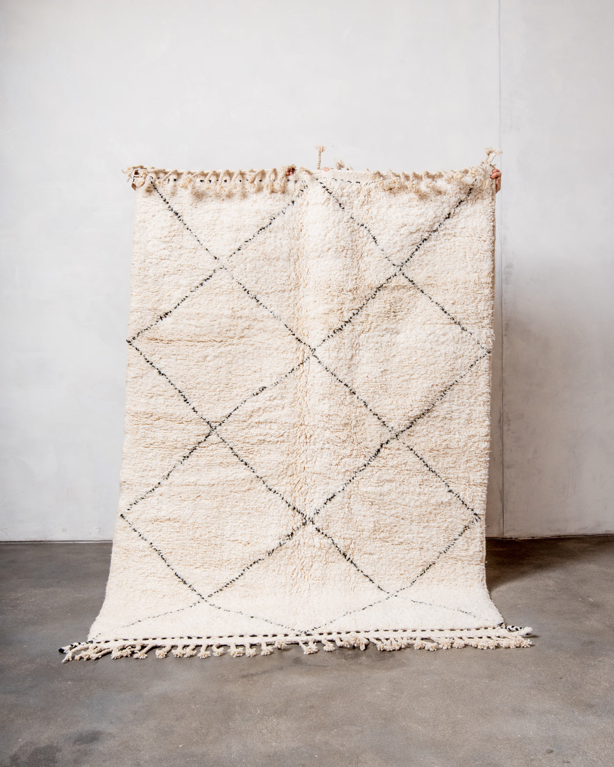 Modern, designer, handcrafted Berber rug from Morocco. Beniourain carpet with minimalist design, natural wool pile and a fluffy texture.