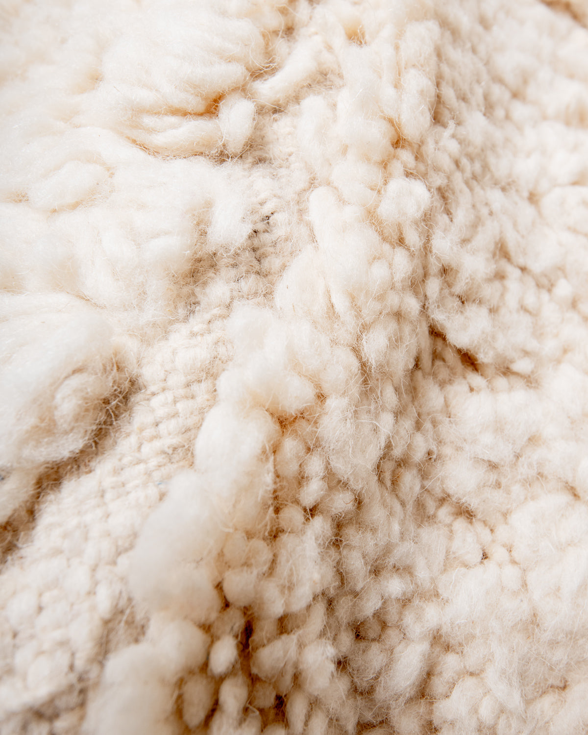 Modern, designer, handcrafted Berber rug from Morocco. Beniourain carpet with minimalist design, natural wool pile and a fluffy texture.