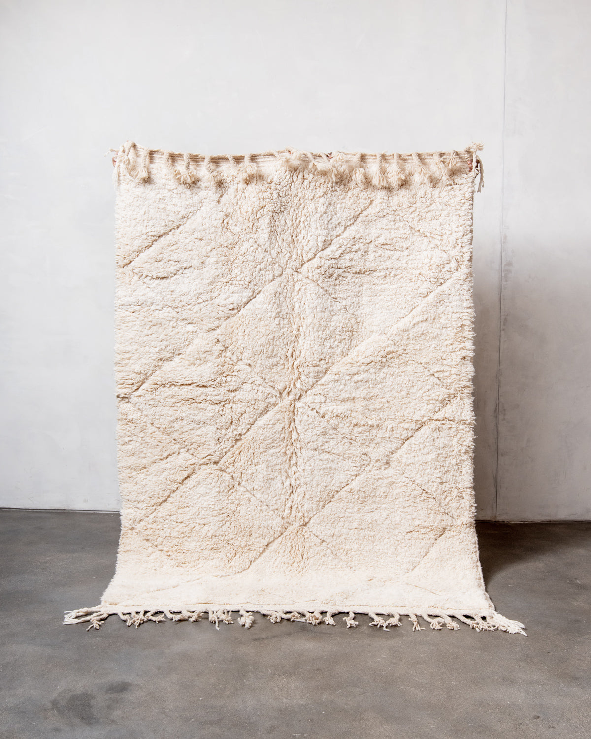 Modern, designer, handcrafted Berber rug from Morocco. Beniourain carpet with minimalist design, natural wool pile and a fluffy texture.