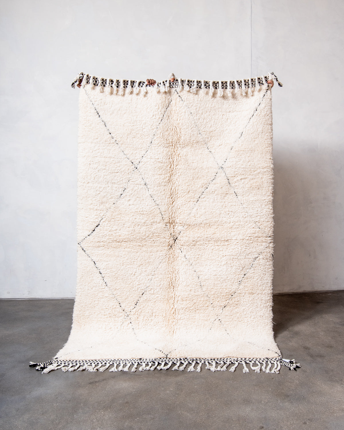 Modern, designer, handcrafted Berber rug from Morocco. Beniourain carpet with minimalist design, natural wool pile and a fluffy texture.