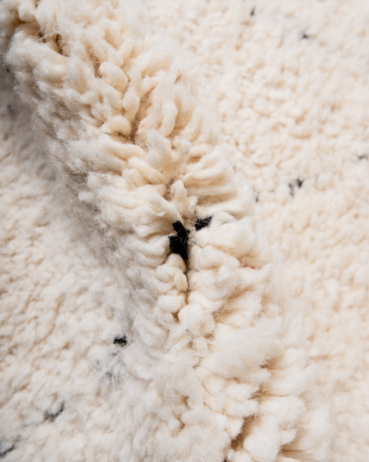 Modern, designer, handcrafted Berber rug from Morocco. Beniourain carpet with minimalist design, natural wool pile and a fluffy texture.