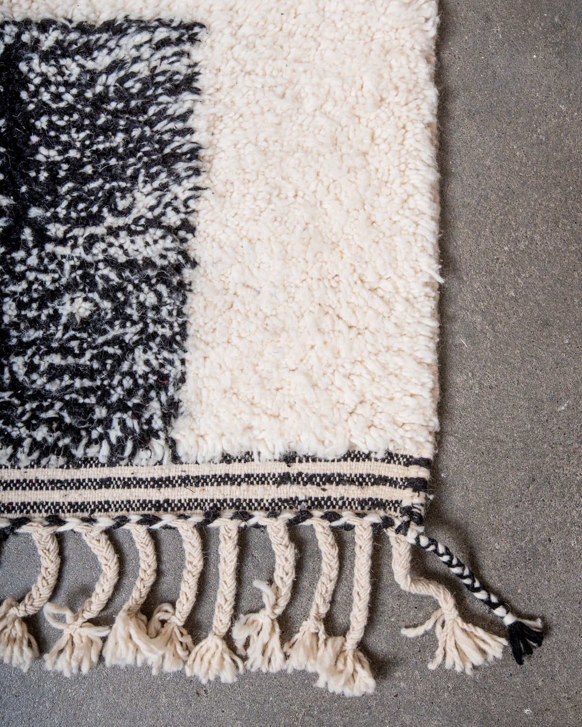 Modern, designer, handcrafted Berber rug from Morocco. Beniourain carpet with minimalist design, natural wool pile and a fluffy texture.
