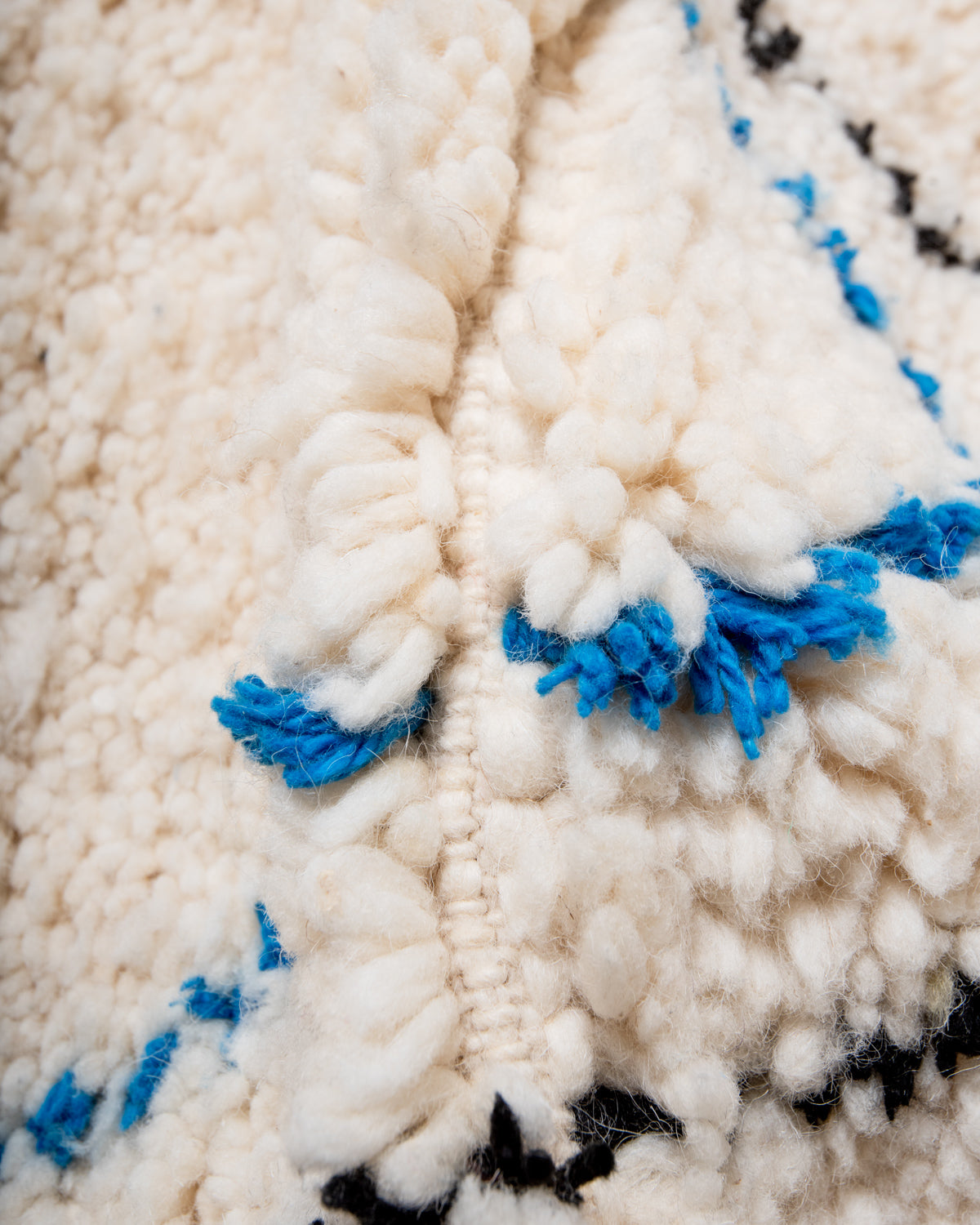 Modern, designer, handcrafted Berber rug from Morocco. Beniourain carpet with beautiful colours and patterns and fluffy wool texture. 