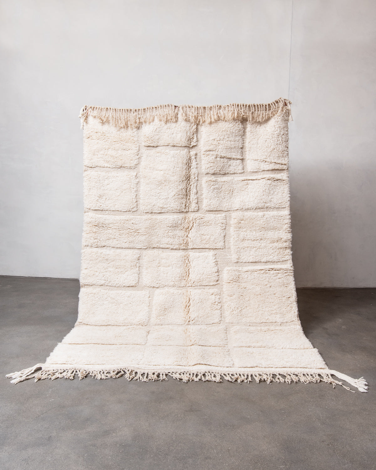 Modern, designer, handcrafted Berber rug from Morocco. Beniourain carpet with minimalist design, natural wool pile and a fluffy texture.