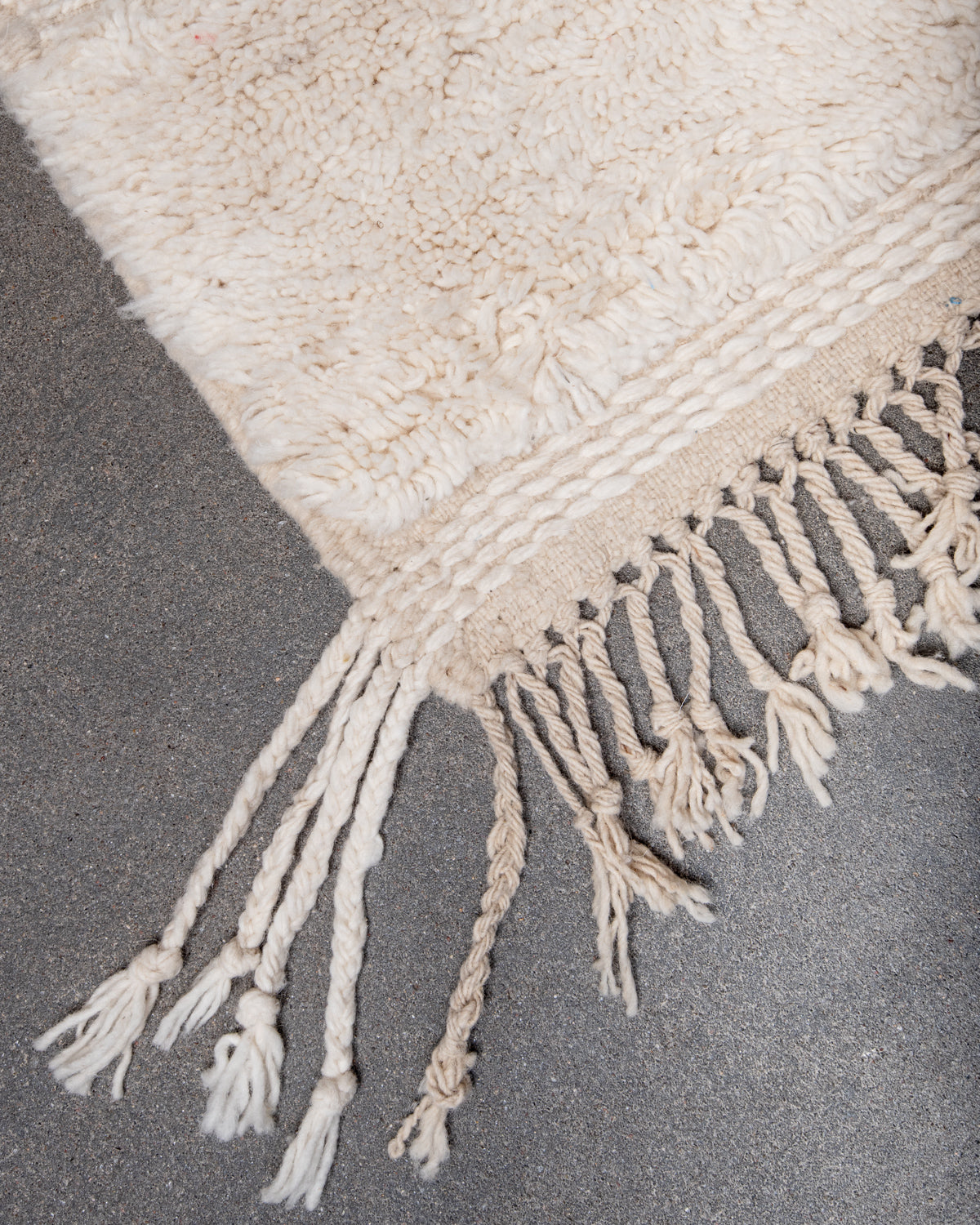Modern, designer, handcrafted Berber rug from Morocco. Beniourain carpet with minimalist design, natural wool pile and a fluffy texture.