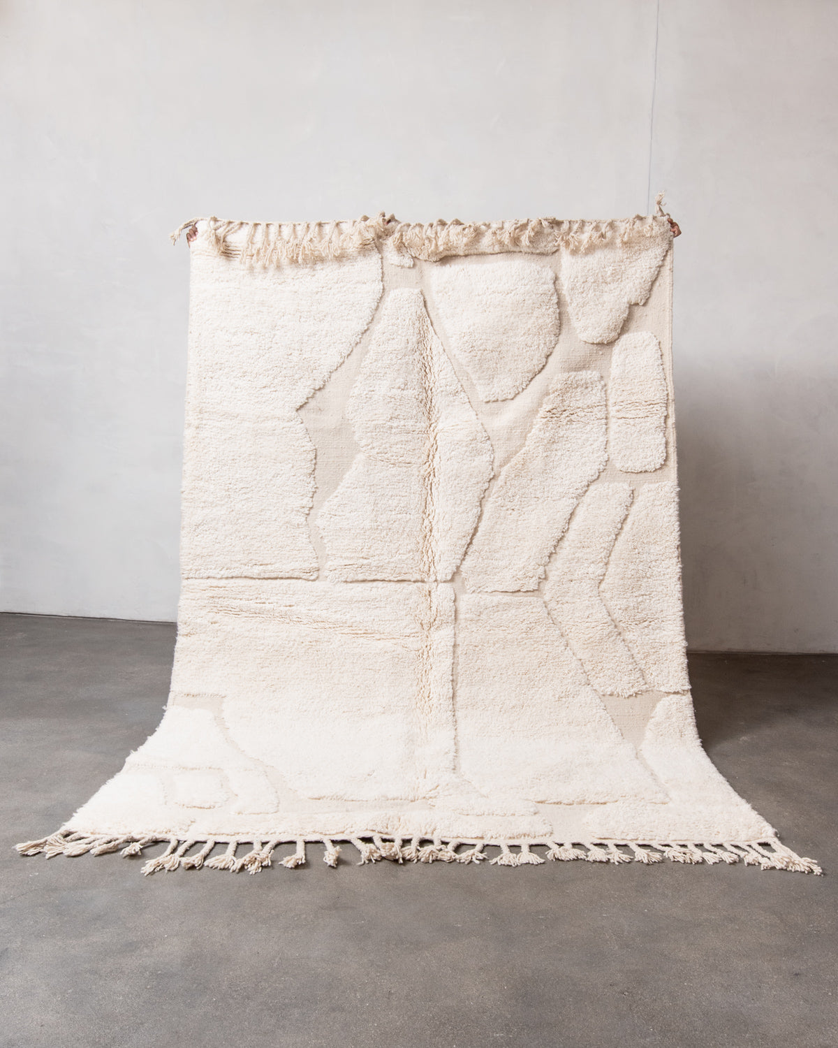 Modern, designer, handcrafted Berber rug from Morocco. Beniourain carpet with minimalist design, natural wool pile and a fluffy texture.