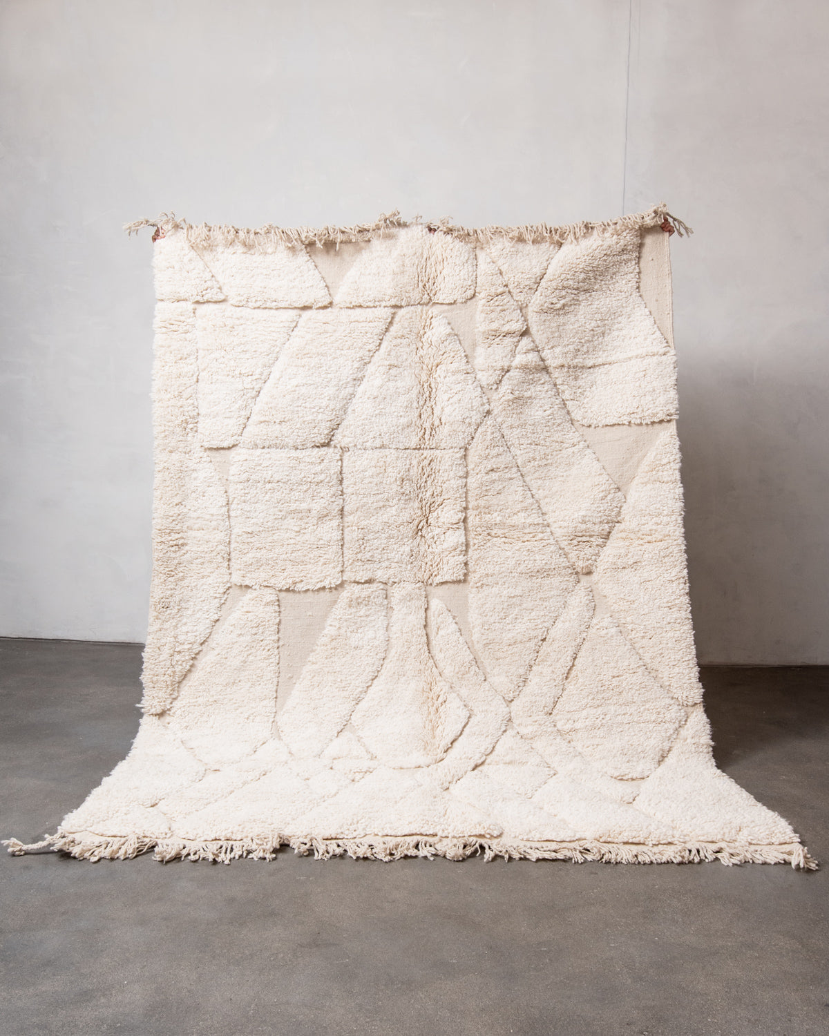 Modern, designer, handcrafted Berber rug from Morocco. Beniourain carpet with minimalist design, natural wool pile and a fluffy texture.