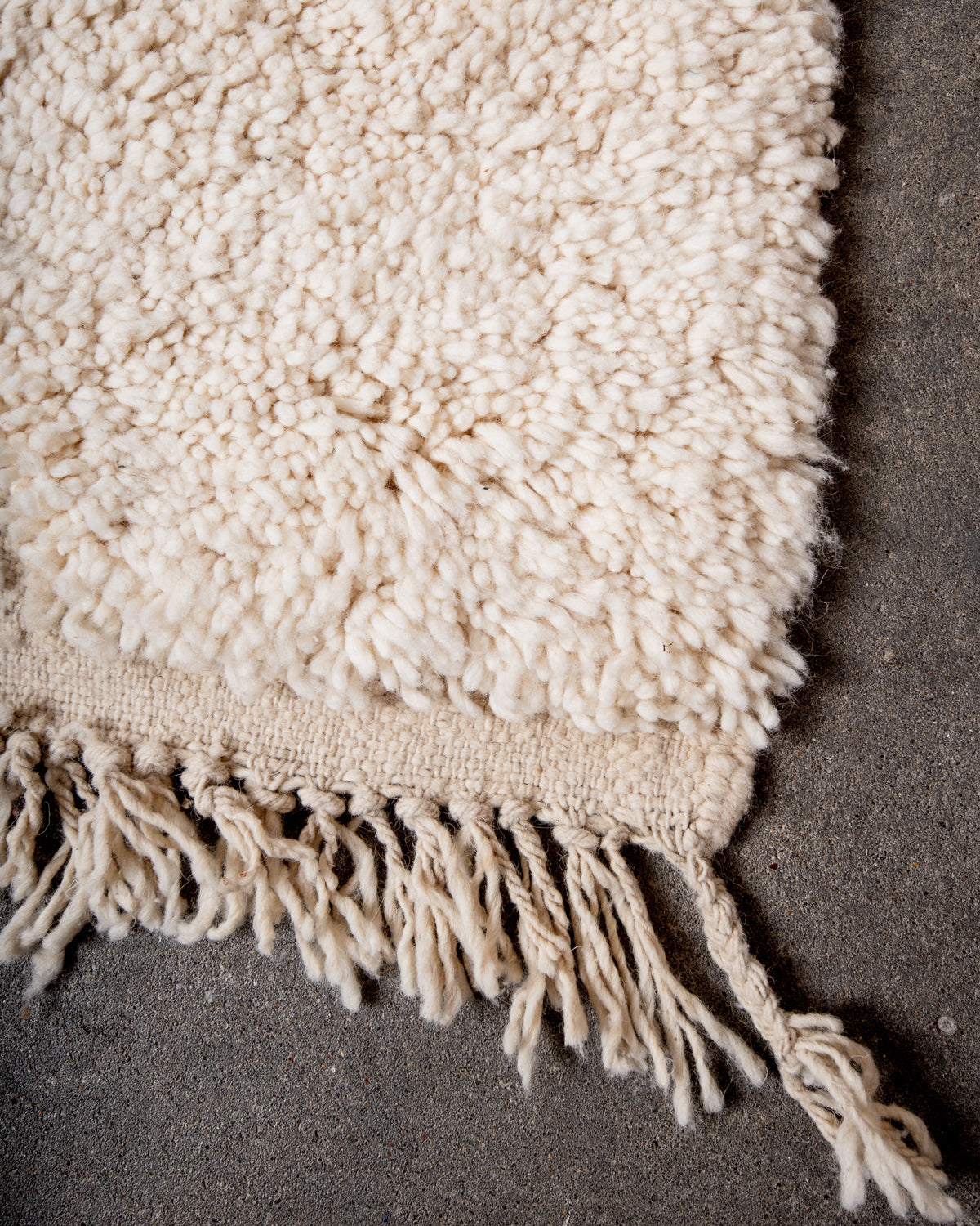 Modern, designer, handcrafted Berber rug from Morocco. Beniourain carpet with minimalist design, natural wool pile and a fluffy texture.
